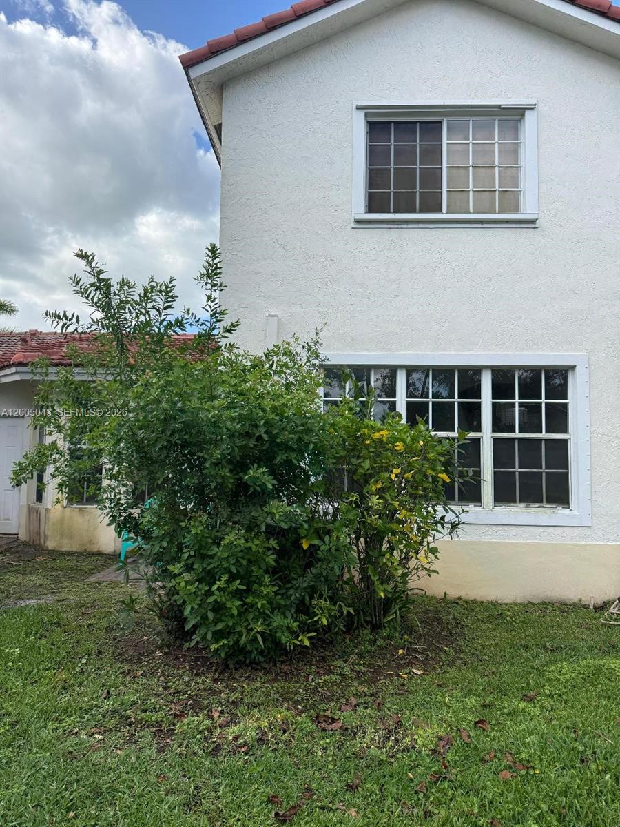 18791 Southwest 25th Court Miramar, FL 33029 - Photo 3 of 4 a front view of a house with a yard