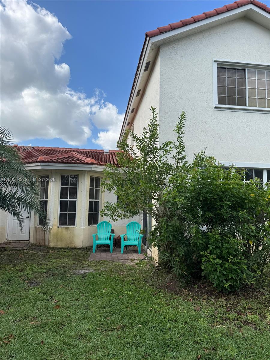 18791 Southwest 25th Court Miramar, FL 33029 - Photo 4 of 4 a front view of a house with garden