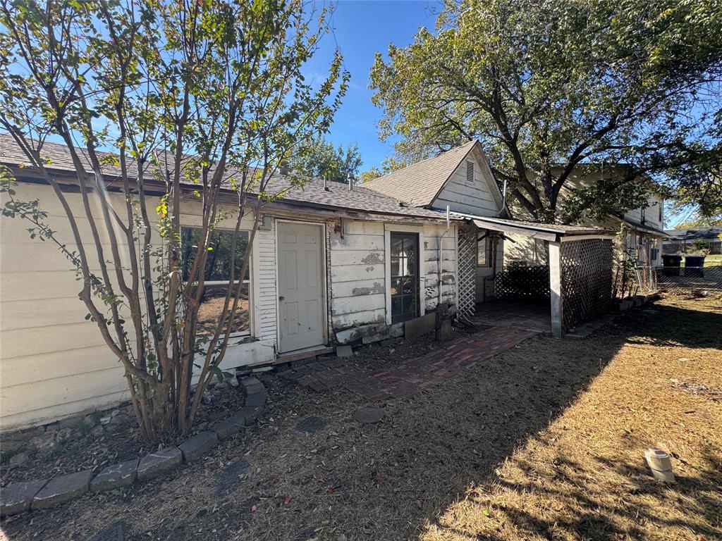 114 Main Street Haslet, TX 76052 - Photo 5 of 14 a view of a house with a yard
