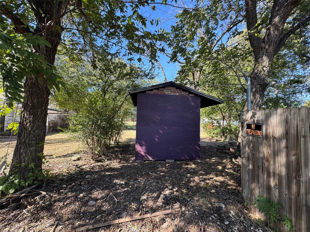 114 Main Street Haslet, TX 76052 - Photo 7 of 14 a view of a house with a yard