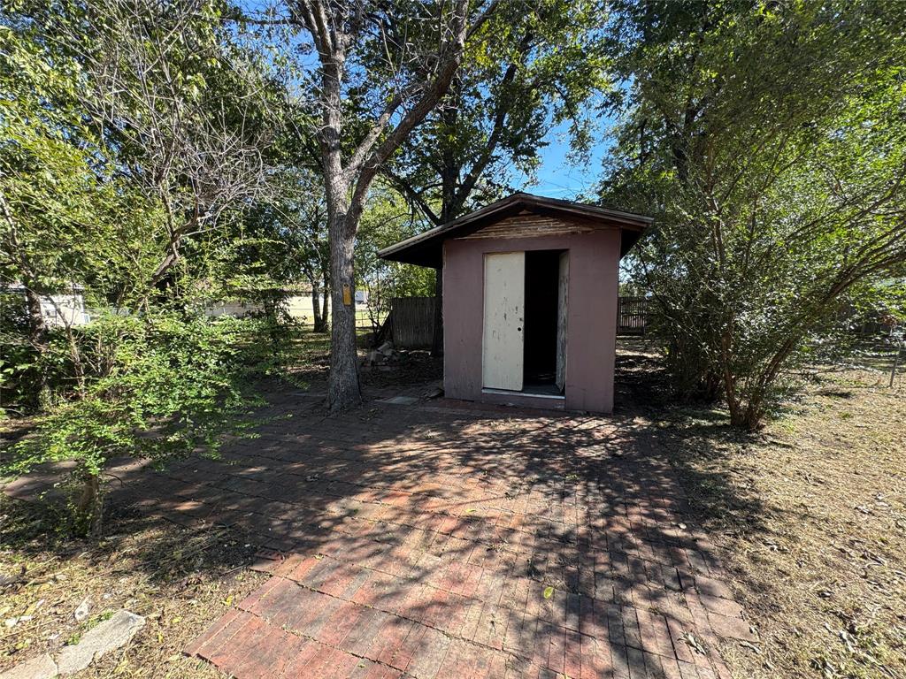 114 Main Street Haslet, TX 76052 - Photo 8 of 14 a view of a house with a yard