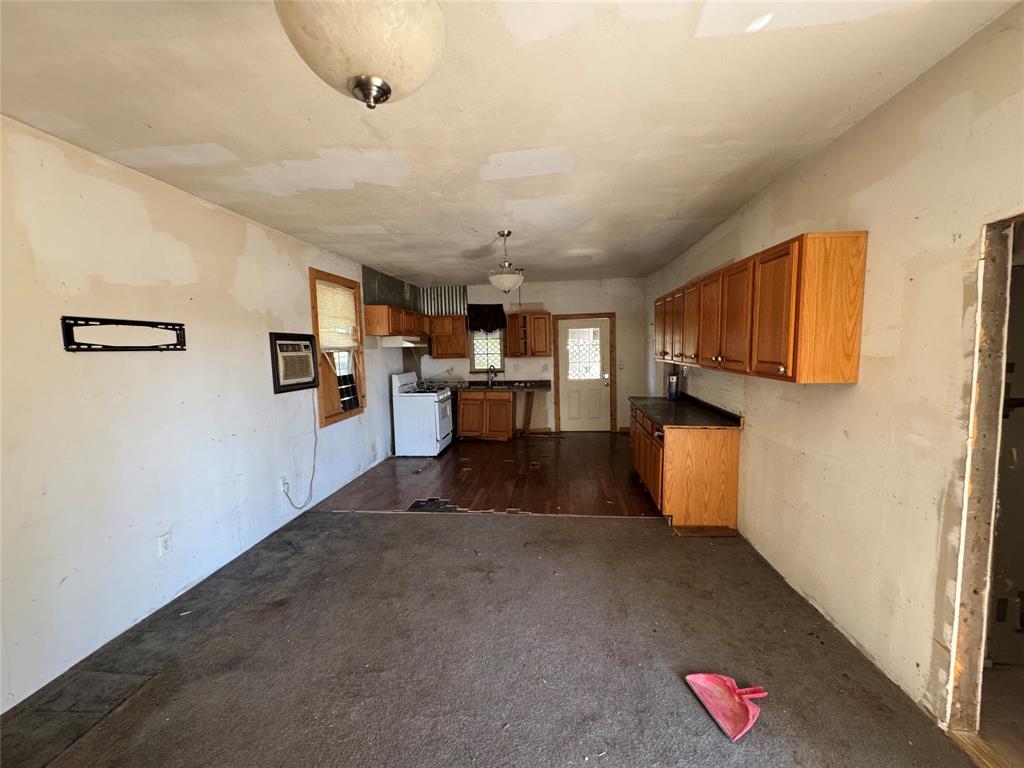 114 Main Street Haslet, TX 76052 - Photo 9 of 14 a view of kitchen with furniture and wooden floor