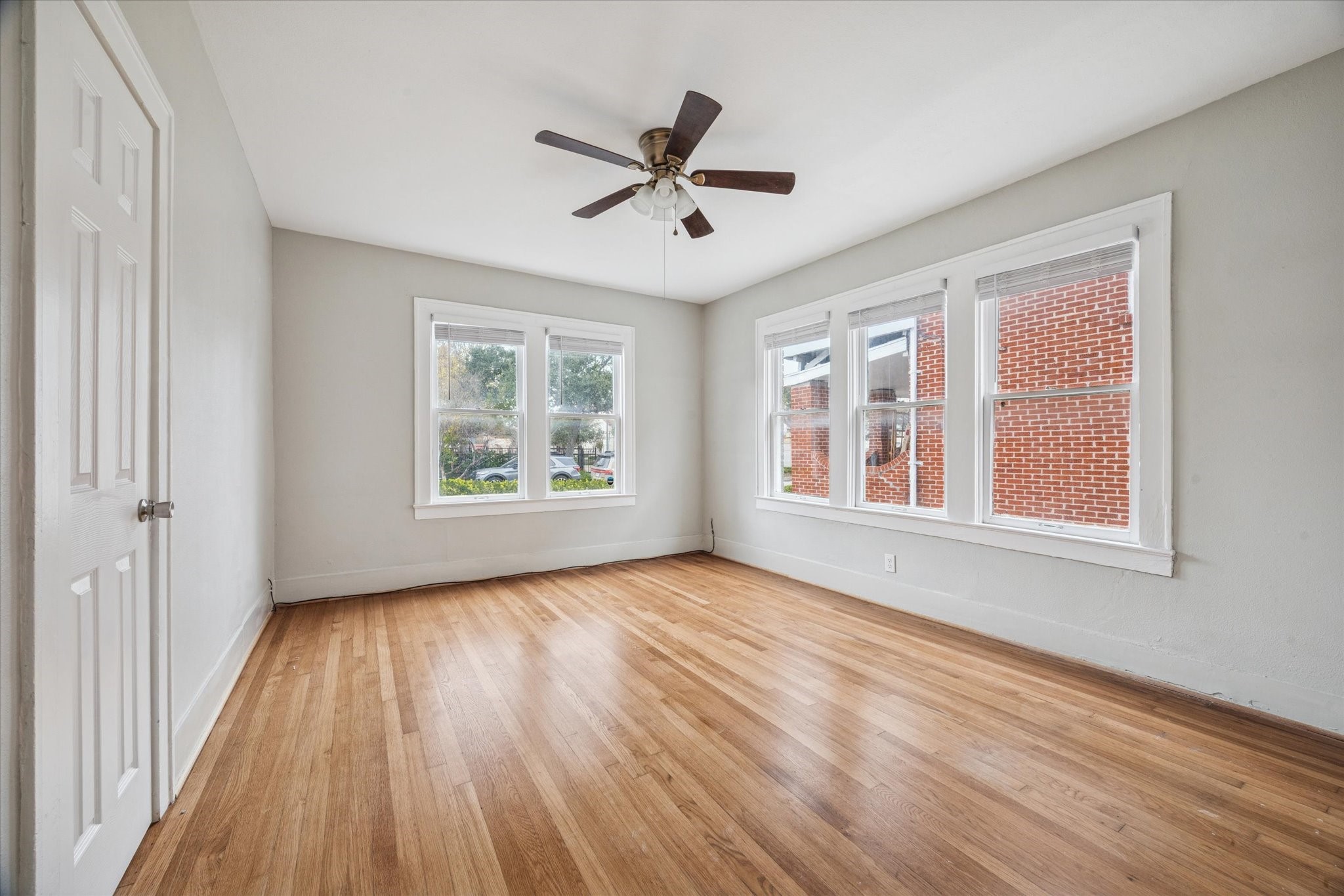 2510 Kingston Street, Unit 1 Houston, TX 77019 - Photo 9 of 12 a view of empty room with wooden floor and fan