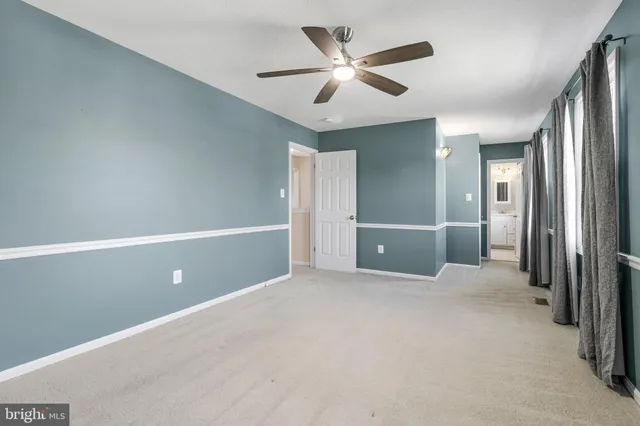 a bathroom with a shower sink and mirror