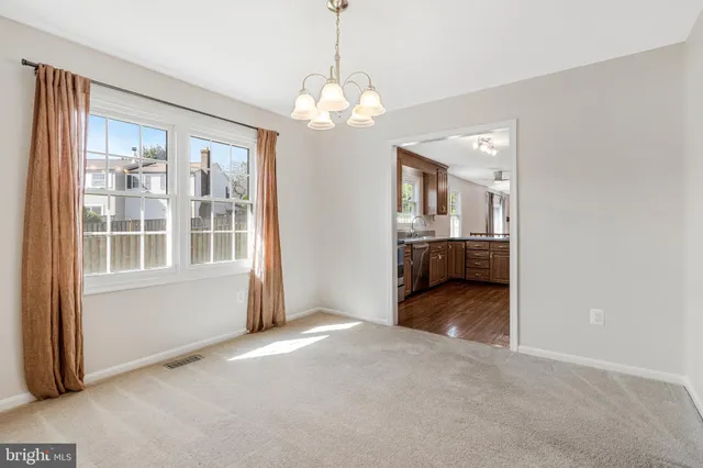 a kitchen with stainless steel appliances granite countertop wooden cabinets granite counter tops and a stove