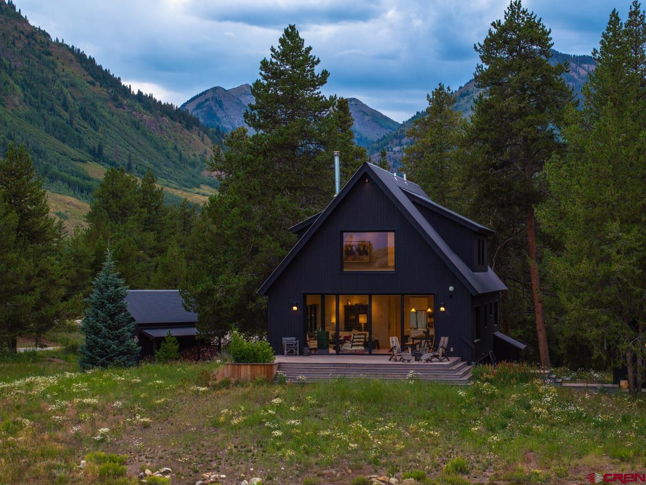 624 Nicholson Lake Ridge Road Crested Butte, CO 81224 - Photo 11 of 43 a view of a house with a yard