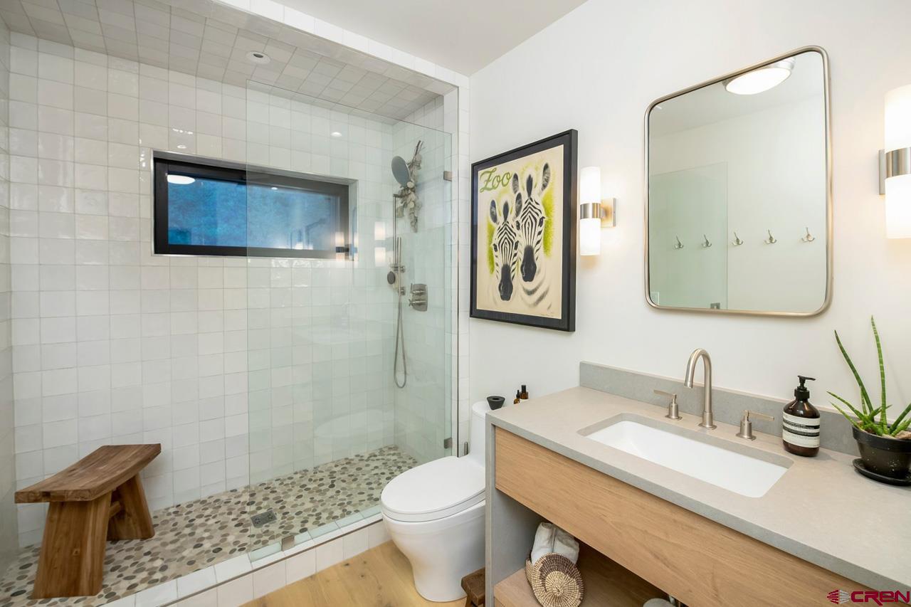 624 Nicholson Lake Ridge Road Crested Butte, CO 81224 - Photo 19 of 43 a bathroom with a sink a toilet and mirror