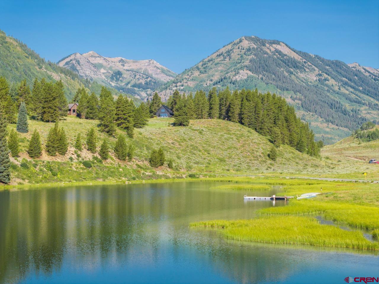 624 Nicholson Lake Ridge Road Crested Butte, CO 81224 - Photo 2 of 43 a view of an ocean with a mountain