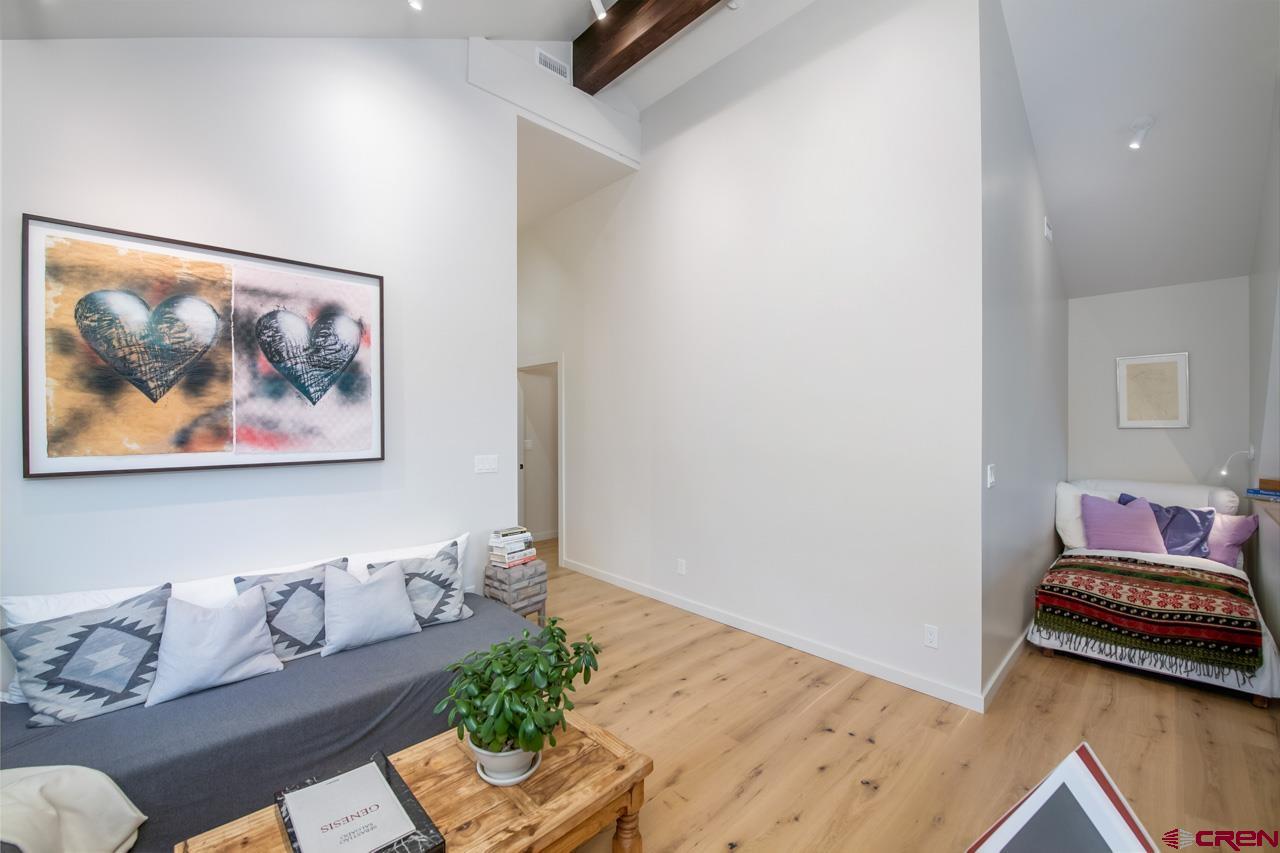 624 Nicholson Lake Ridge Road Crested Butte, CO 81224 - Photo 22 of 43 a living room with furniture and wooden floor