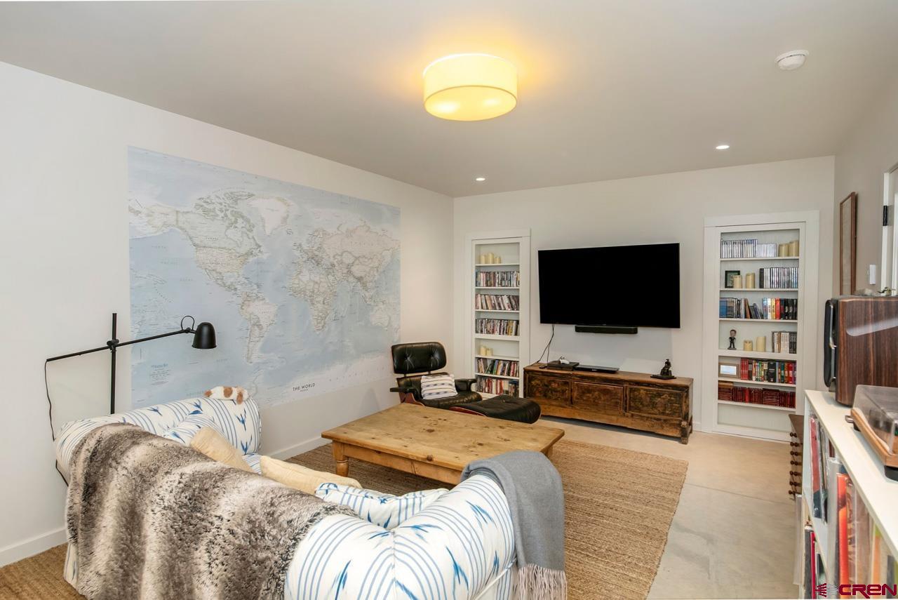 624 Nicholson Lake Ridge Road Crested Butte, CO 81224 - Photo 24 of 43 a bedroom with a bed and a flat screen tv