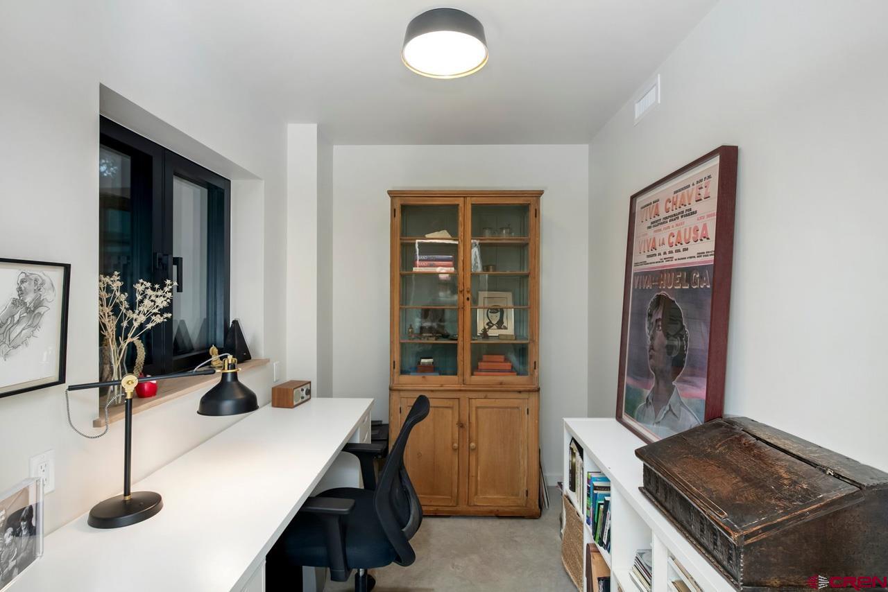 624 Nicholson Lake Ridge Road Crested Butte, CO 81224 - Photo 25 of 43 a view of a workspace with furniture and gym equipment