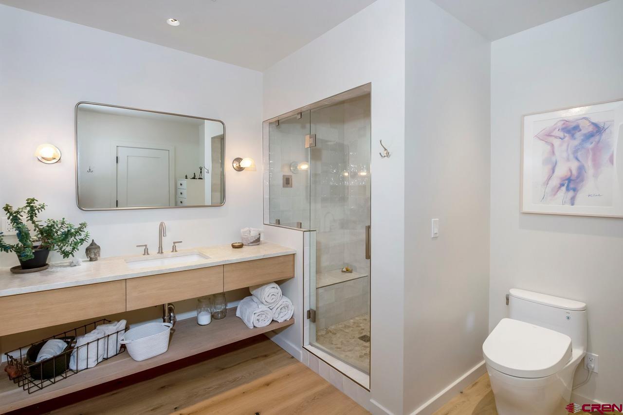 624 Nicholson Lake Ridge Road Crested Butte, CO 81224 - Photo 28 of 43 a bathroom with a double vanity sink mirror and toilet