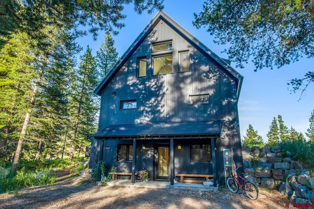 624 Nicholson Lake Ridge Road Crested Butte, CO 81224 - Photo 3 of 43 a front view of a house with garden