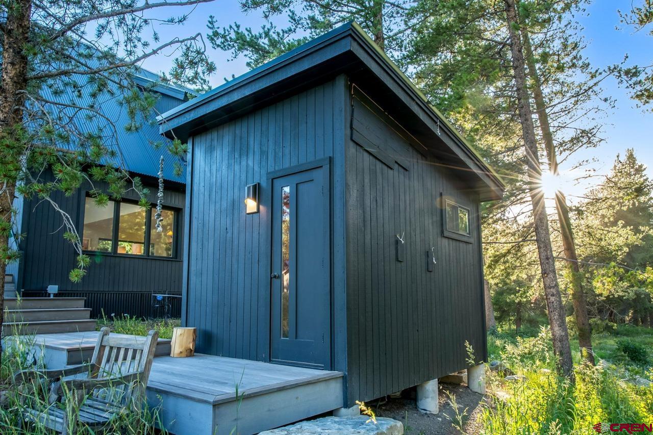 624 Nicholson Lake Ridge Road Crested Butte, CO 81224 - Photo 35 of 43 a backyard of a house with outdoor seating