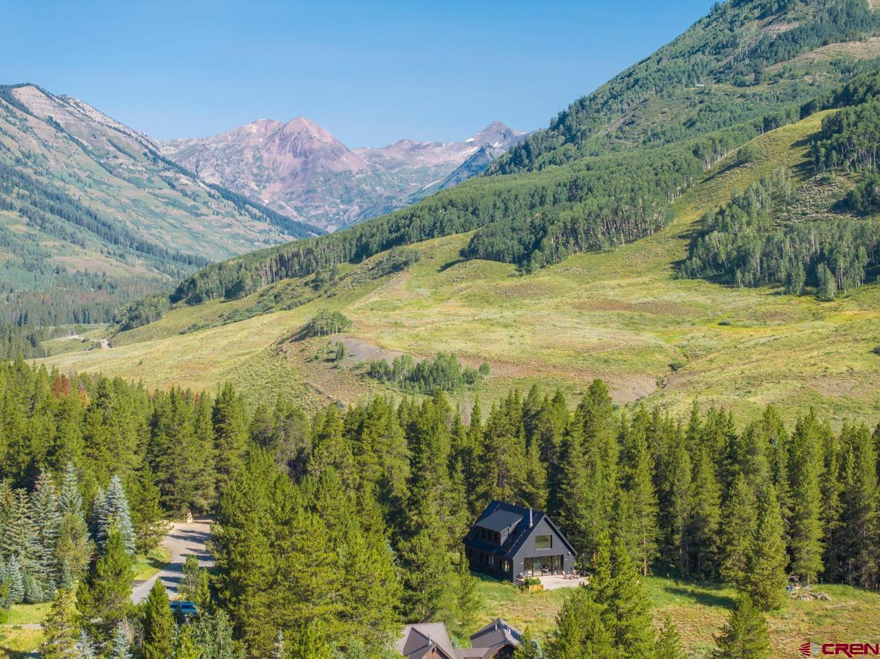 624 Nicholson Lake Ridge Road Crested Butte, CO 81224 - Photo 39 of 43 a view of a lake with mountains in the background