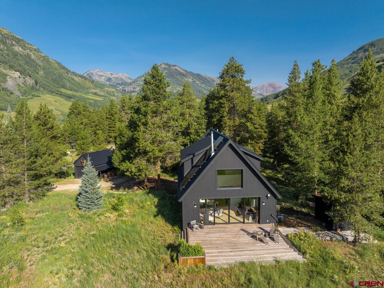 624 Nicholson Lake Ridge Road Crested Butte, CO 81224 - Photo 42 of 43 a house with trees in the background