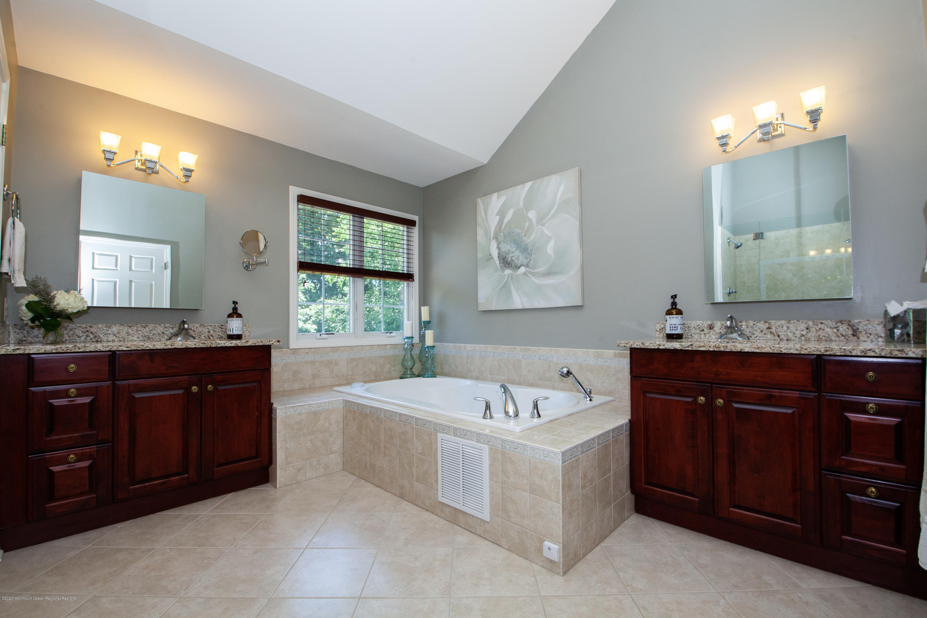 2228 Christopher Way Wall, NJ 07719 - Photo 13 of 25 a spacious bathroom with a tub sink and mirror