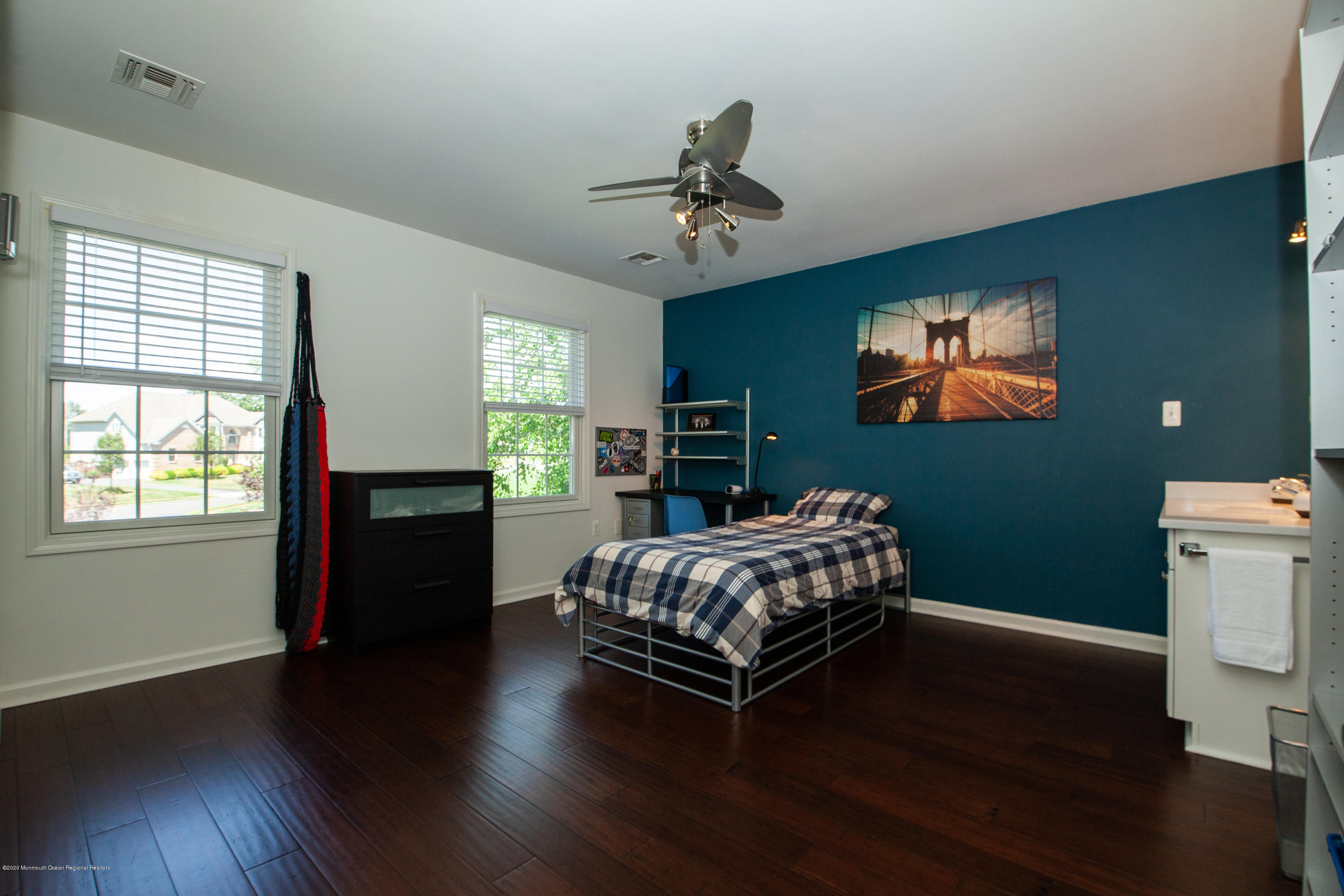 2228 Christopher Way Wall, NJ 07719 - Photo 14 of 25 a bedroom with a bed and wooden floor
