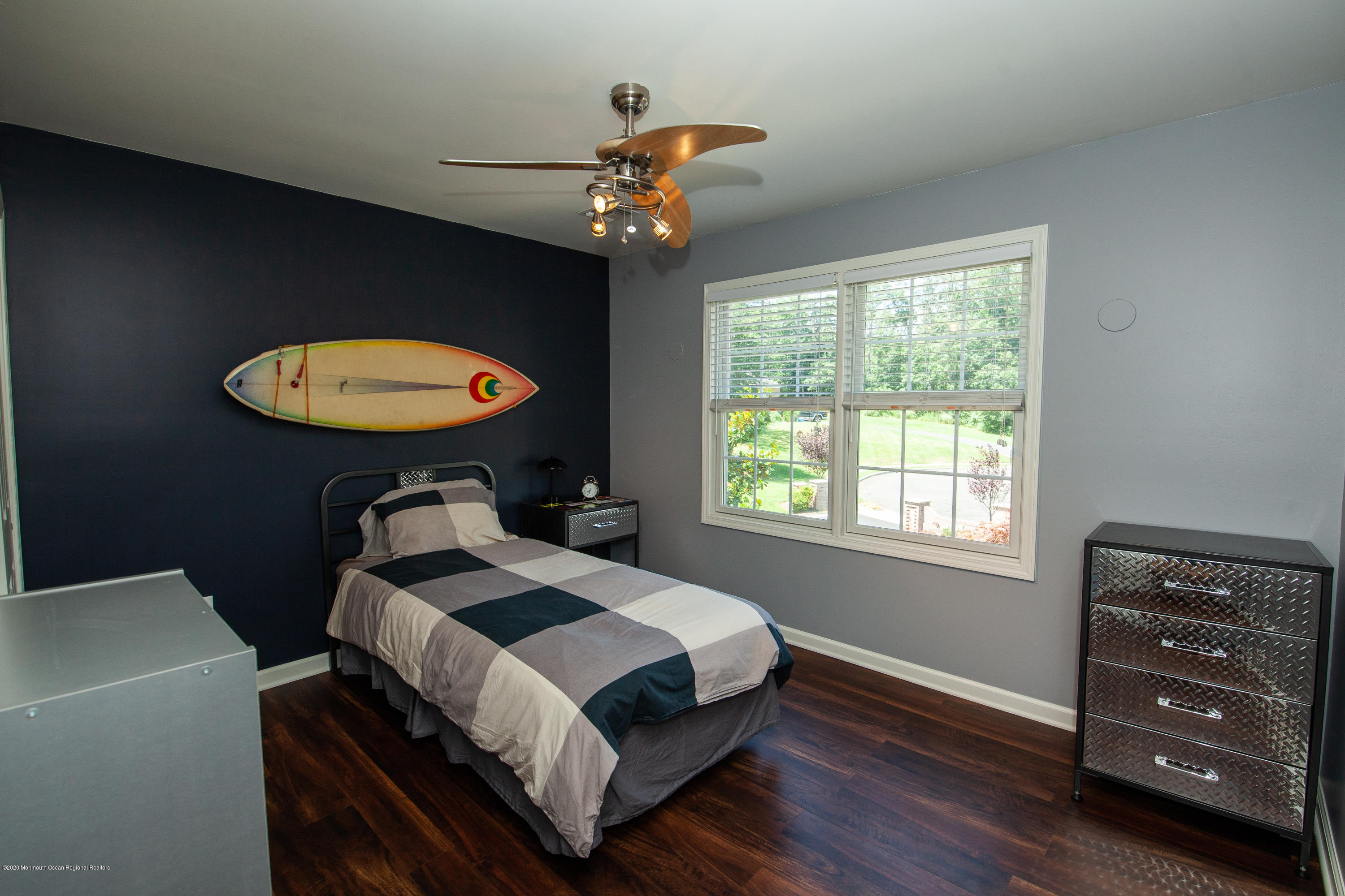 2228 Christopher Way Wall, NJ 07719 - Photo 15 of 25 a bedroom with a bed and a chandelier