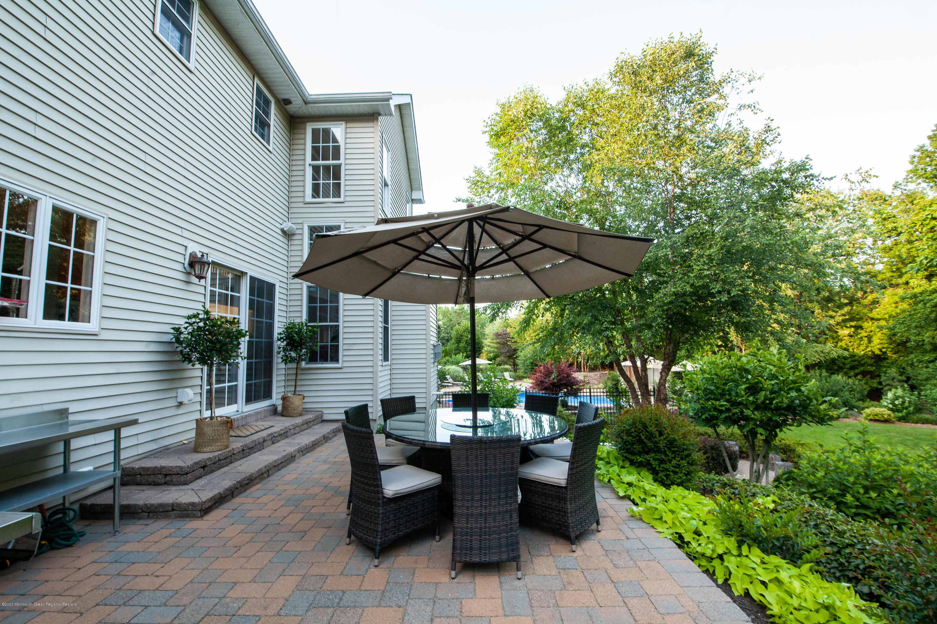 2228 Christopher Way Wall, NJ 07719 - Photo 20 of 25 a view of a tables and chairs under an umbrella