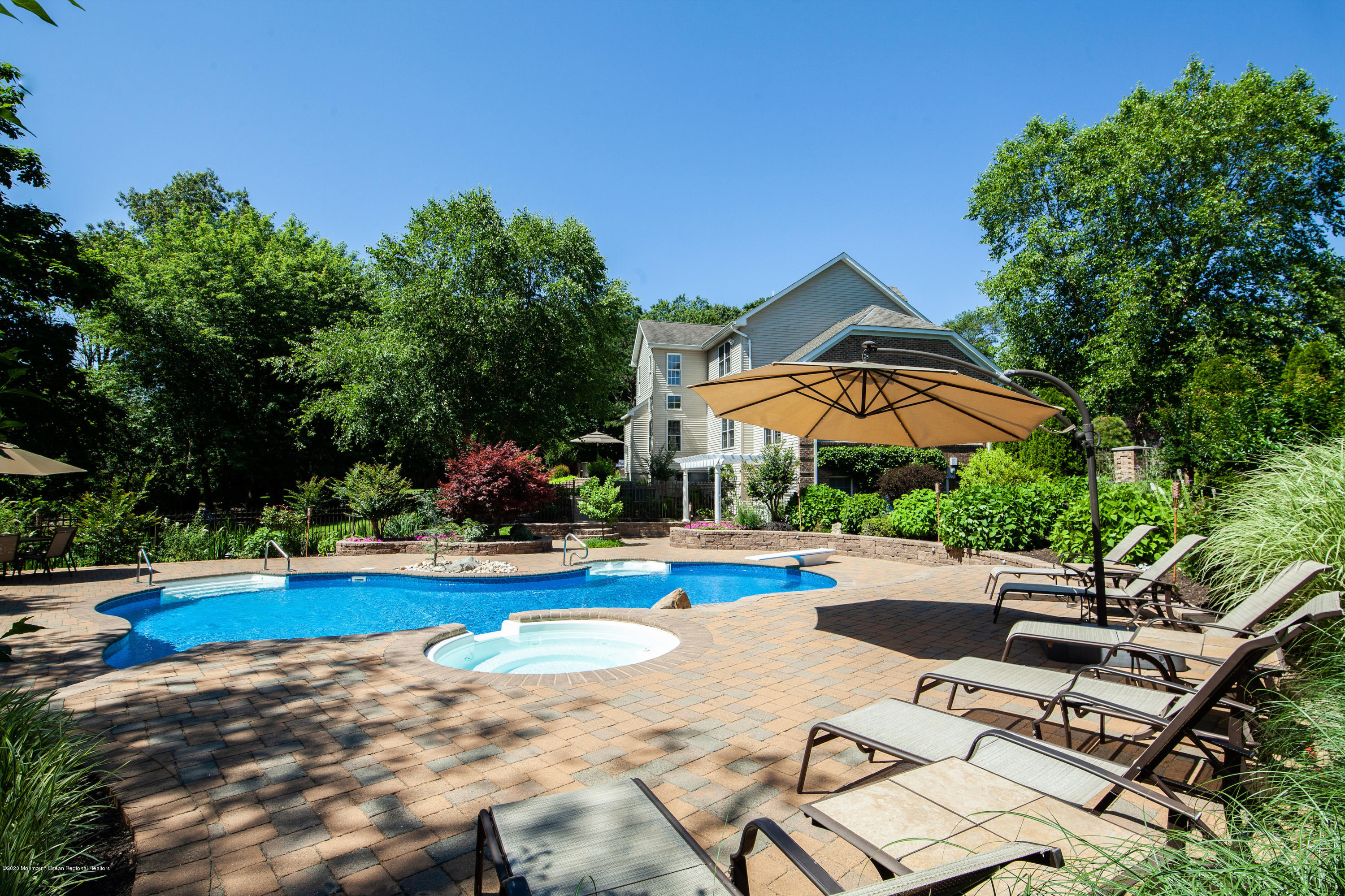 2228 Christopher Way Wall, NJ 07719 - Photo 22 of 25 a view of a swimming pool with lounge chairs