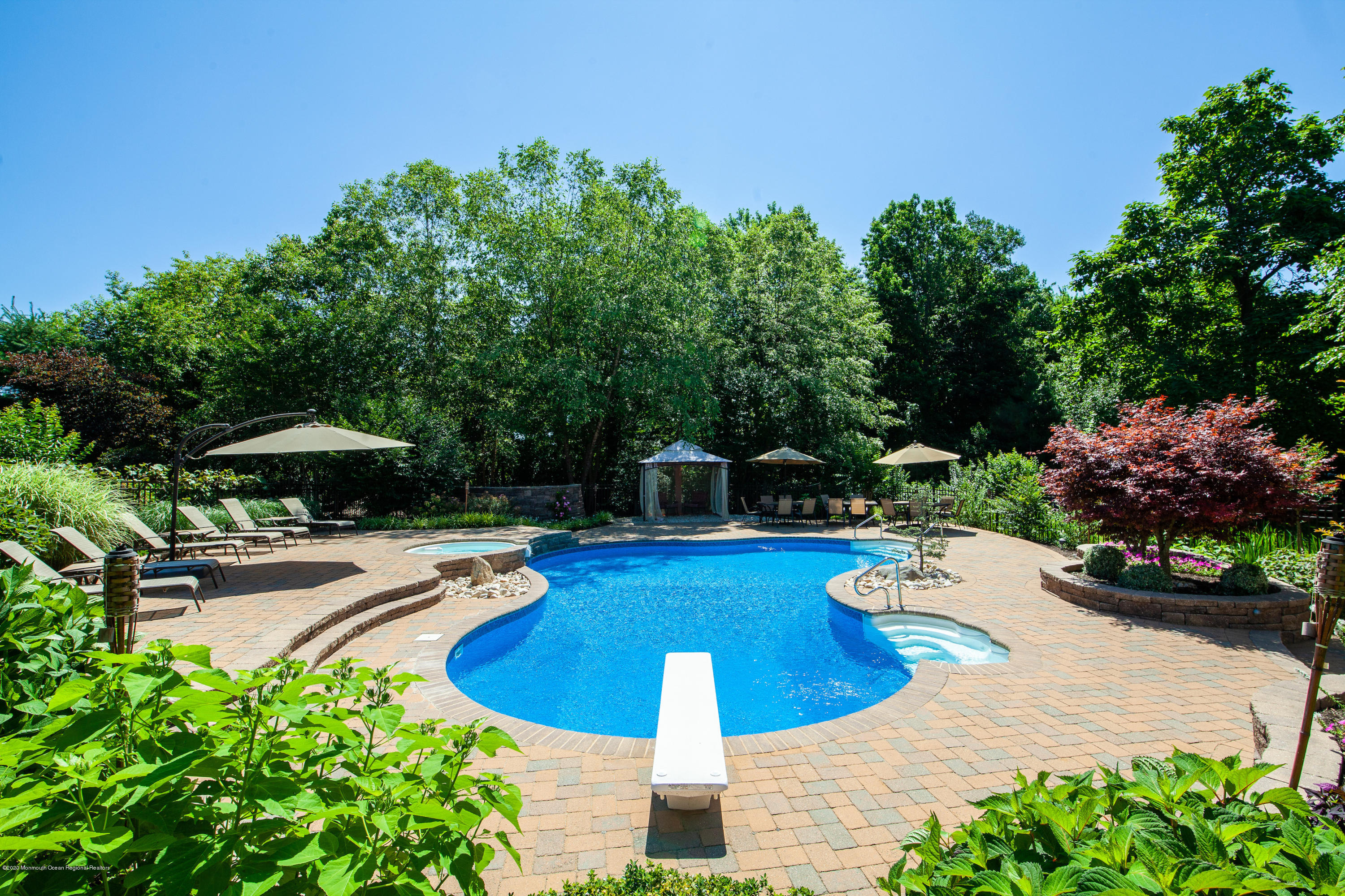 2228 Christopher Way Wall, NJ 07719 - Photo 23 of 25 a view of a swimming pool with lounge chair