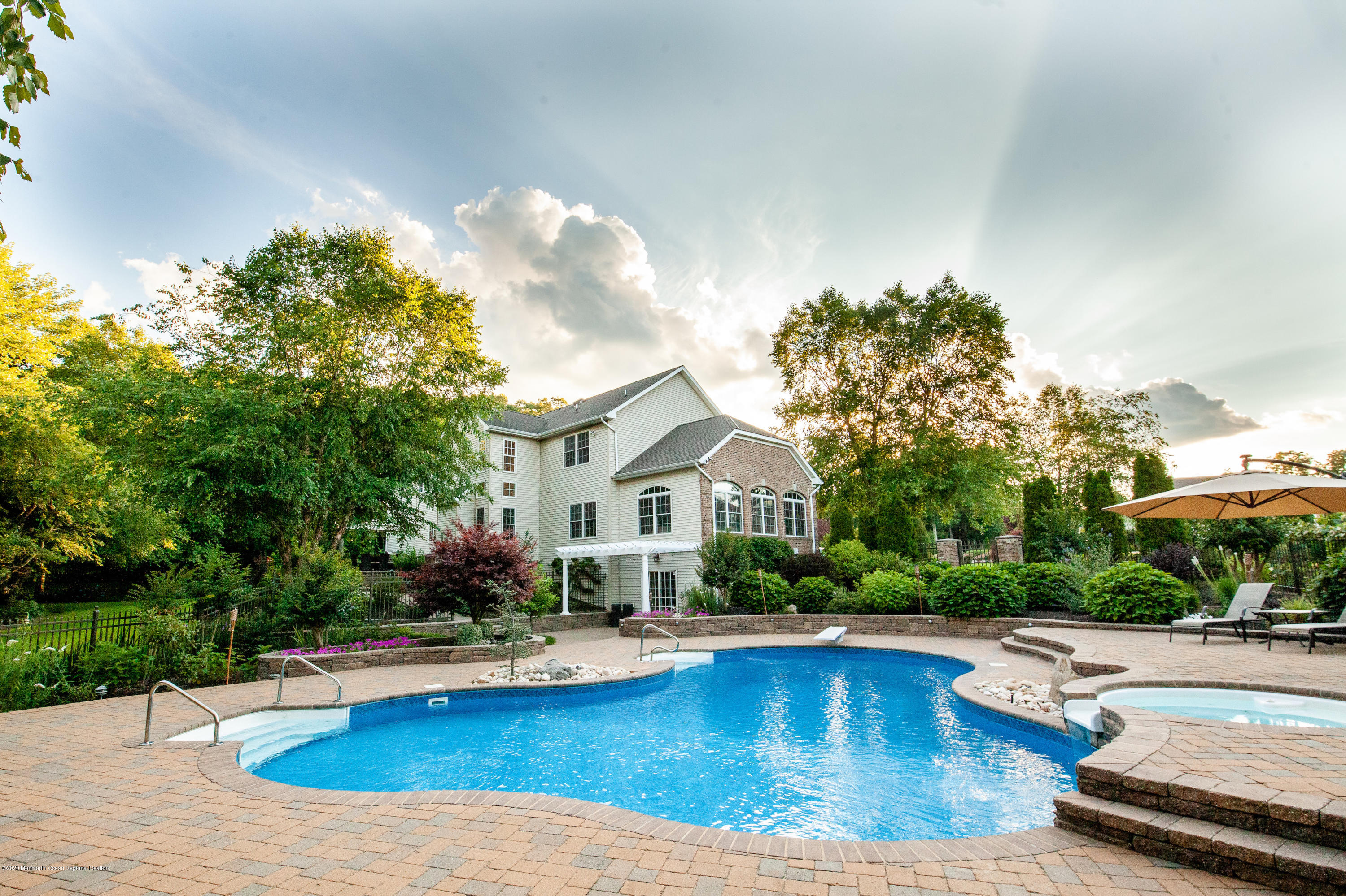 2228 Christopher Way Wall, NJ 07719 - Photo 24 of 25 a view of a house with swimming pool and sitting area