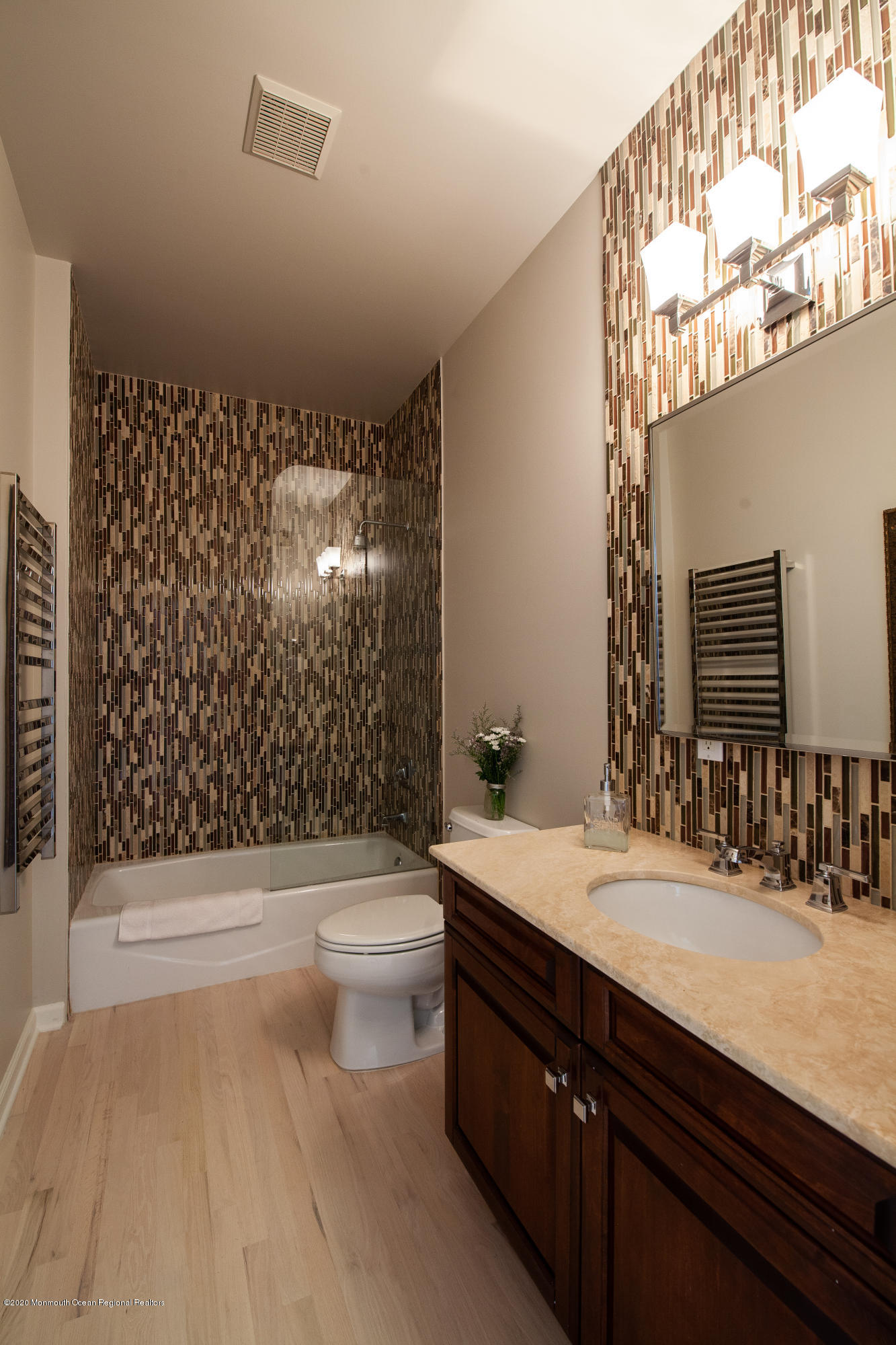 2228 Christopher Way Wall, NJ 07719 - Photo 8 of 25 a bathroom with a sink a toilet a mirror and shower