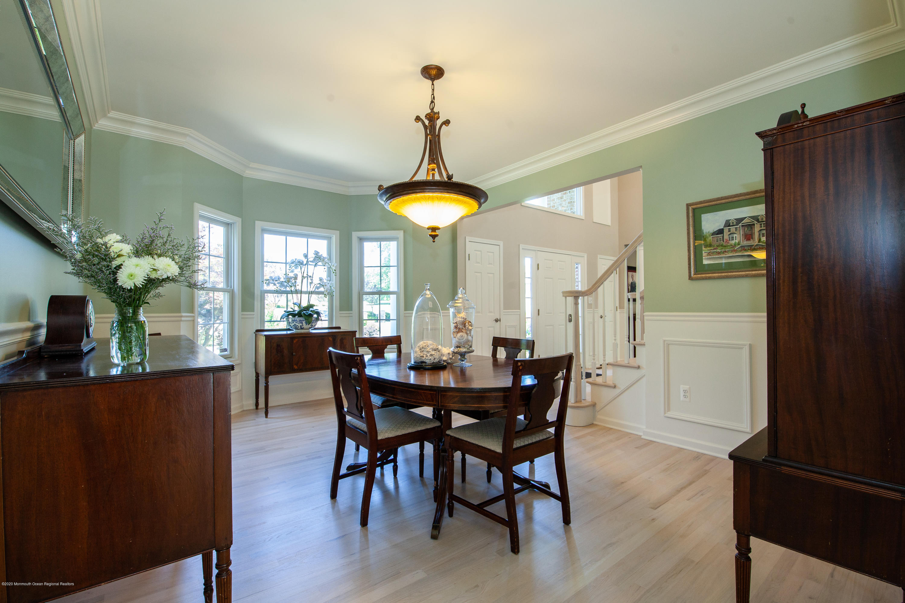 2228 Christopher Way Wall, NJ 07719 - Photo 9 of 25 a dining room with furniture a chandelier and window