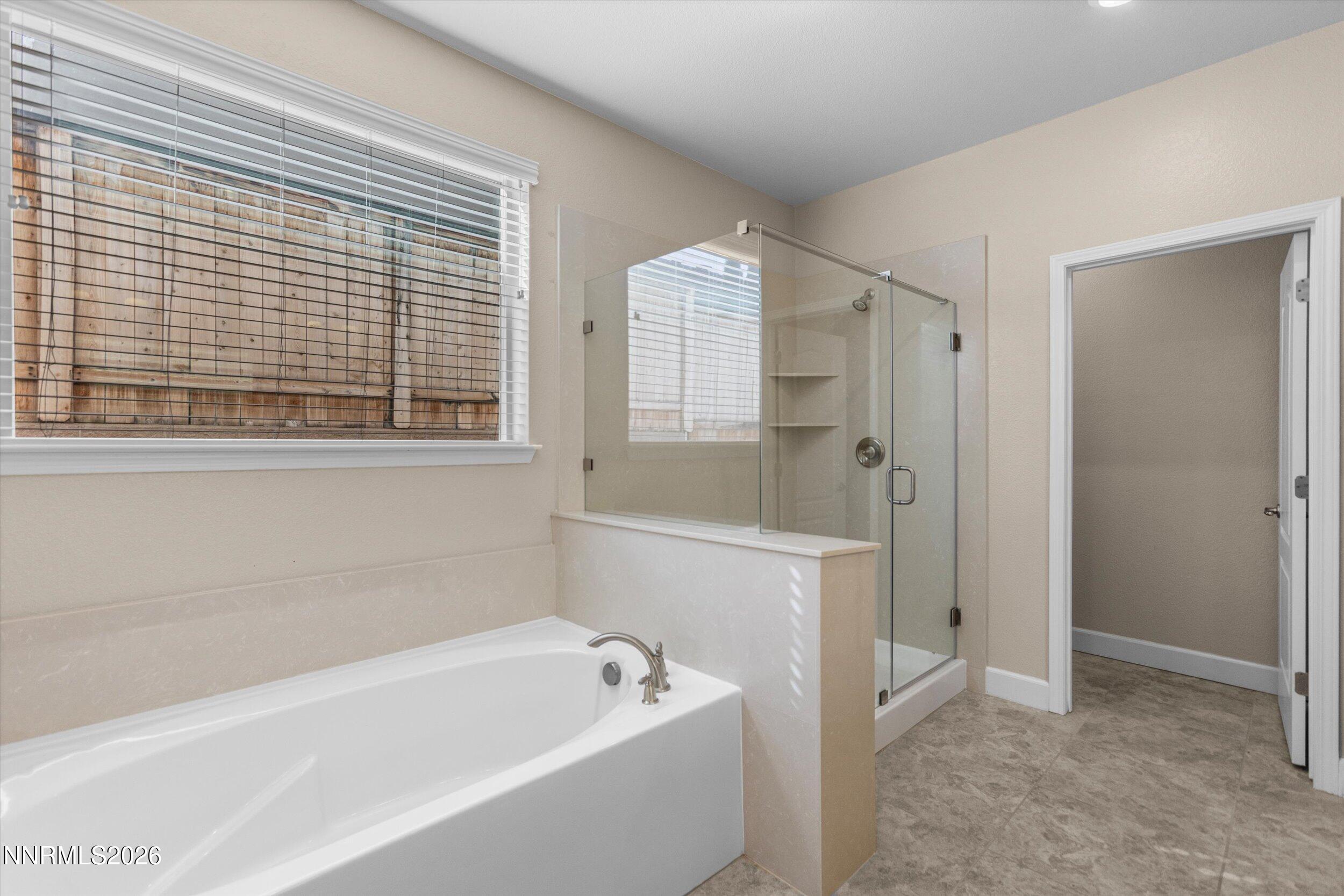 1725 Verdi Vista Court Reno, NV 89523 - Photo 18 of 37 a bathroom with a bathtub and shower