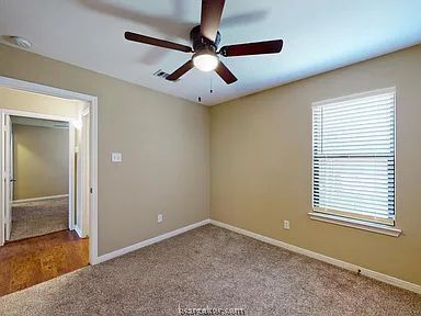 2024 Mountain Wind Loop Bryan, TX 77807 - Photo 12 of 14 a view of an empty room with window and wooden floor