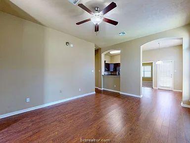 2024 Mountain Wind Loop Bryan, TX 77807 - Photo 2 of 14 a view of an empty room with window and wooden floor