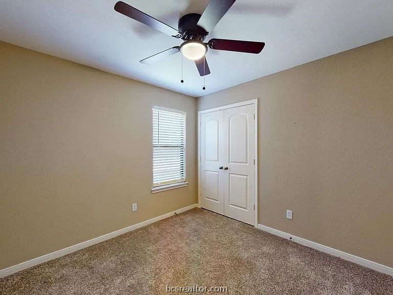 2024 Mountain Wind Loop Bryan, TX 77807 - Photo 10 of 14 a view of an empty room with a window