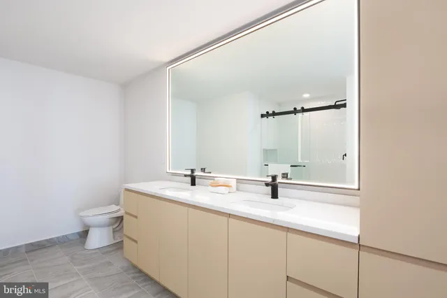 a view of a bathroom with tub and shower