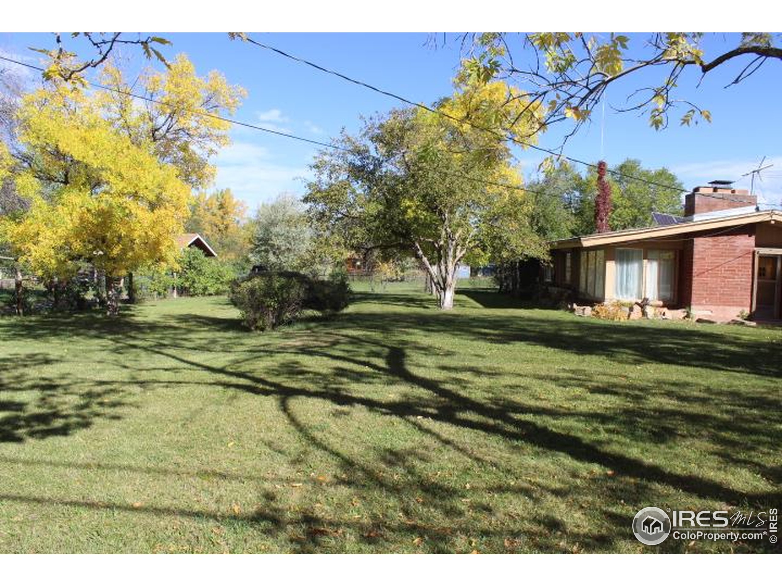6137 Baseline Road Boulder, CO 80303 - Photo 16 of 40 a view of a house with a big yard