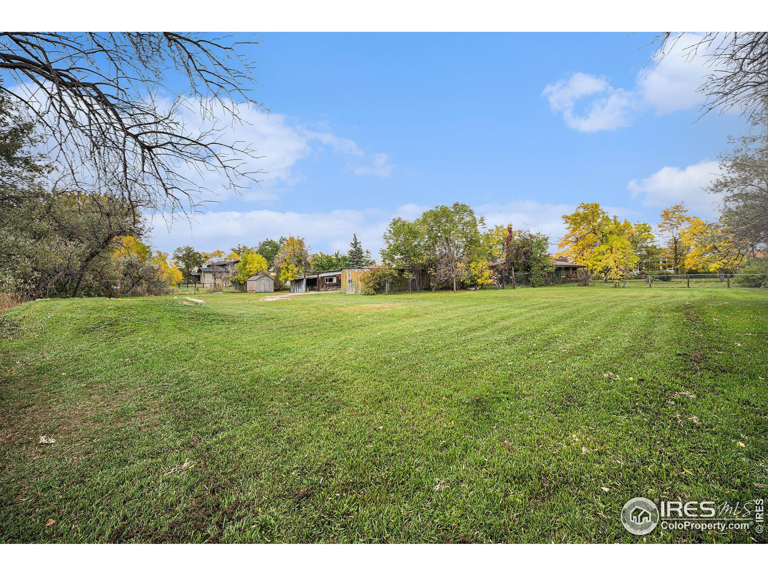 6137 Baseline Road Boulder, CO 80303 - Photo 18 of 40 a backyard of a house with lots of green space