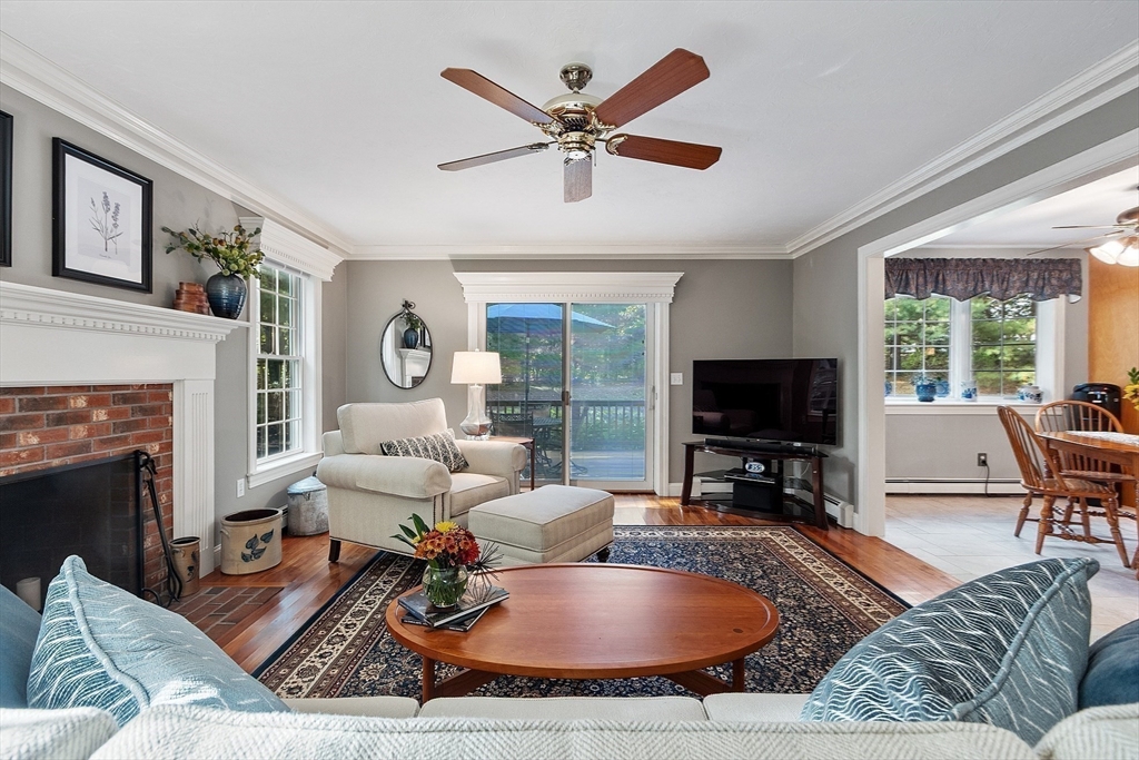 2 Taymax Road Westminster, MA 01473 - Photo 11 of 41 a living room with furniture a fireplace and a flat screen tv