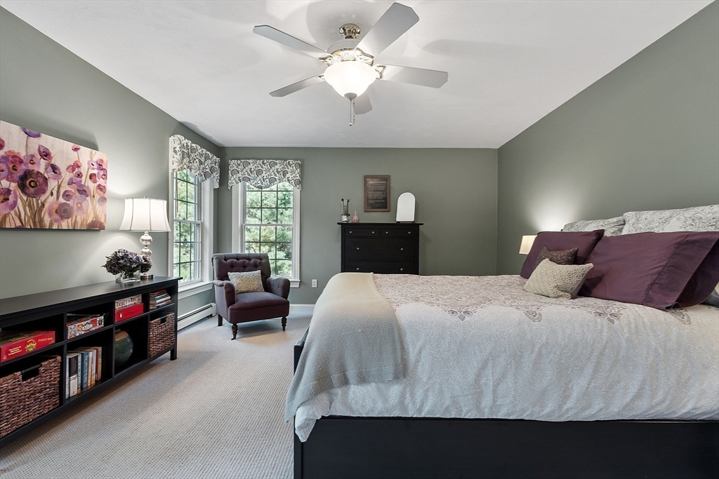 2 Taymax Road Westminster, MA 01473 - Photo 28 of 41 a bedroom with a bed and a chandelier