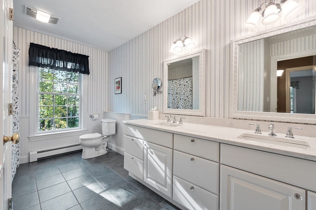 2 Taymax Road Westminster, MA 01473 - Photo 30 of 41 a bathroom with a toilet sink and mirror
