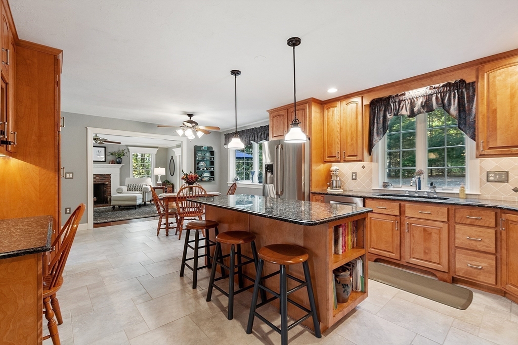 2 Taymax Road Westminster, MA 01473 - Photo 4 of 41 a open kitchen with stainless steel appliances granite countertop a table chairs and a refrigerator