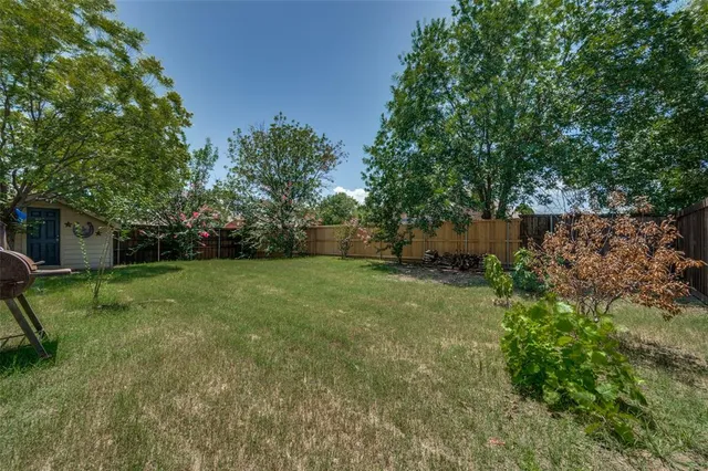 a view of a backyard with a garden