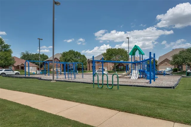 a view of a house with a yard and sitting area