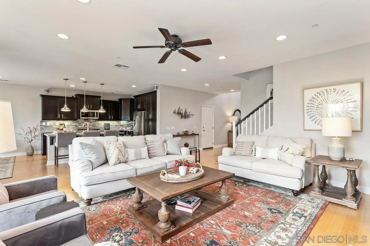 1014 Bellingham Drive Oceanside, CA 92057 - Photo 14 of 33 a living room with furniture kitchen view and a table