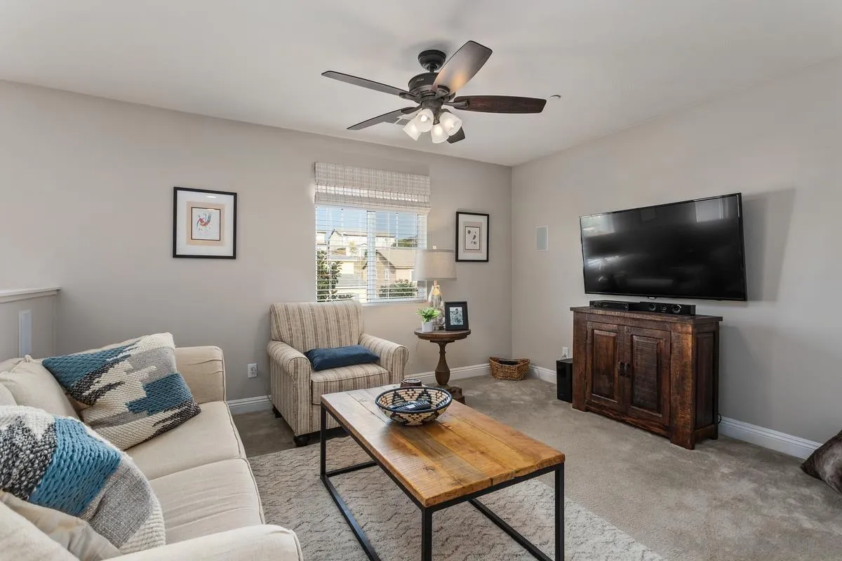 1014 Bellingham Drive Oceanside, CA 92057 - Photo 17 of 33 a living room with furniture and a flat screen tv