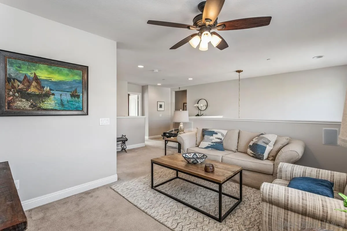 1014 Bellingham Drive Oceanside, CA 92057 - Photo 18 of 33 a living room with furniture and a ceiling fan