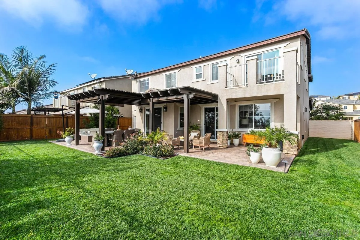 1014 Bellingham Drive Oceanside, CA 92057 - Photo 30 of 33 a view of a house with backyard porch and sitting area