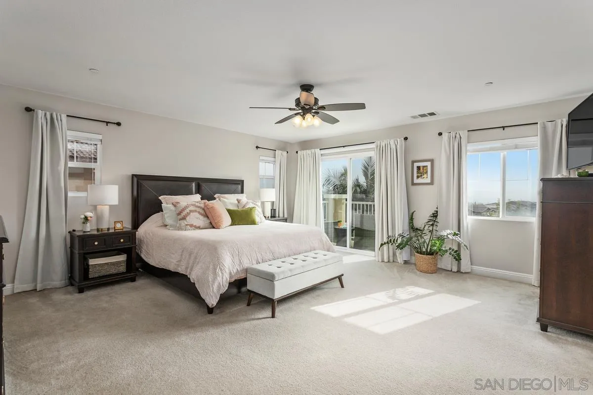 1014 Bellingham Drive Oceanside, CA 92057 - Photo 5 of 33 a bed sitting in a spacious bedroom next to a window