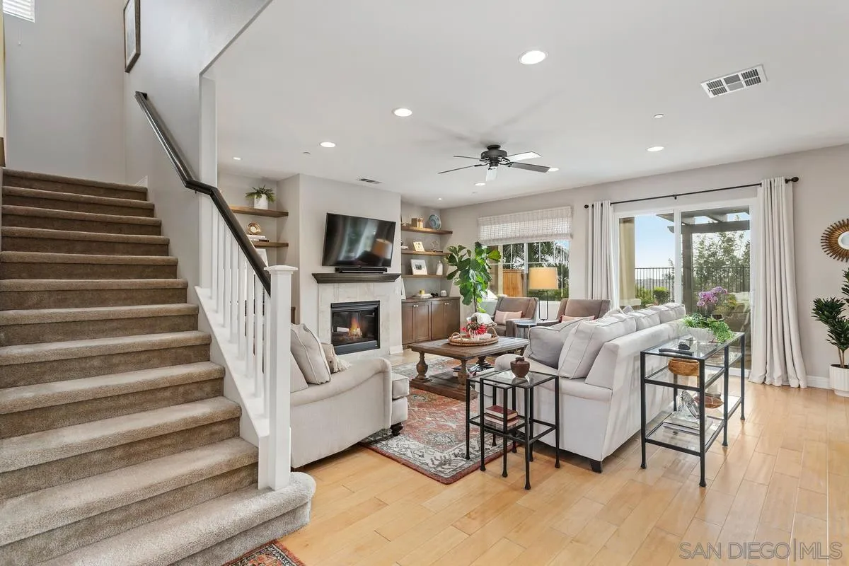 1014 Bellingham Drive Oceanside, CA 92057 - Photo 8 of 33 a living room with furniture and a fireplace