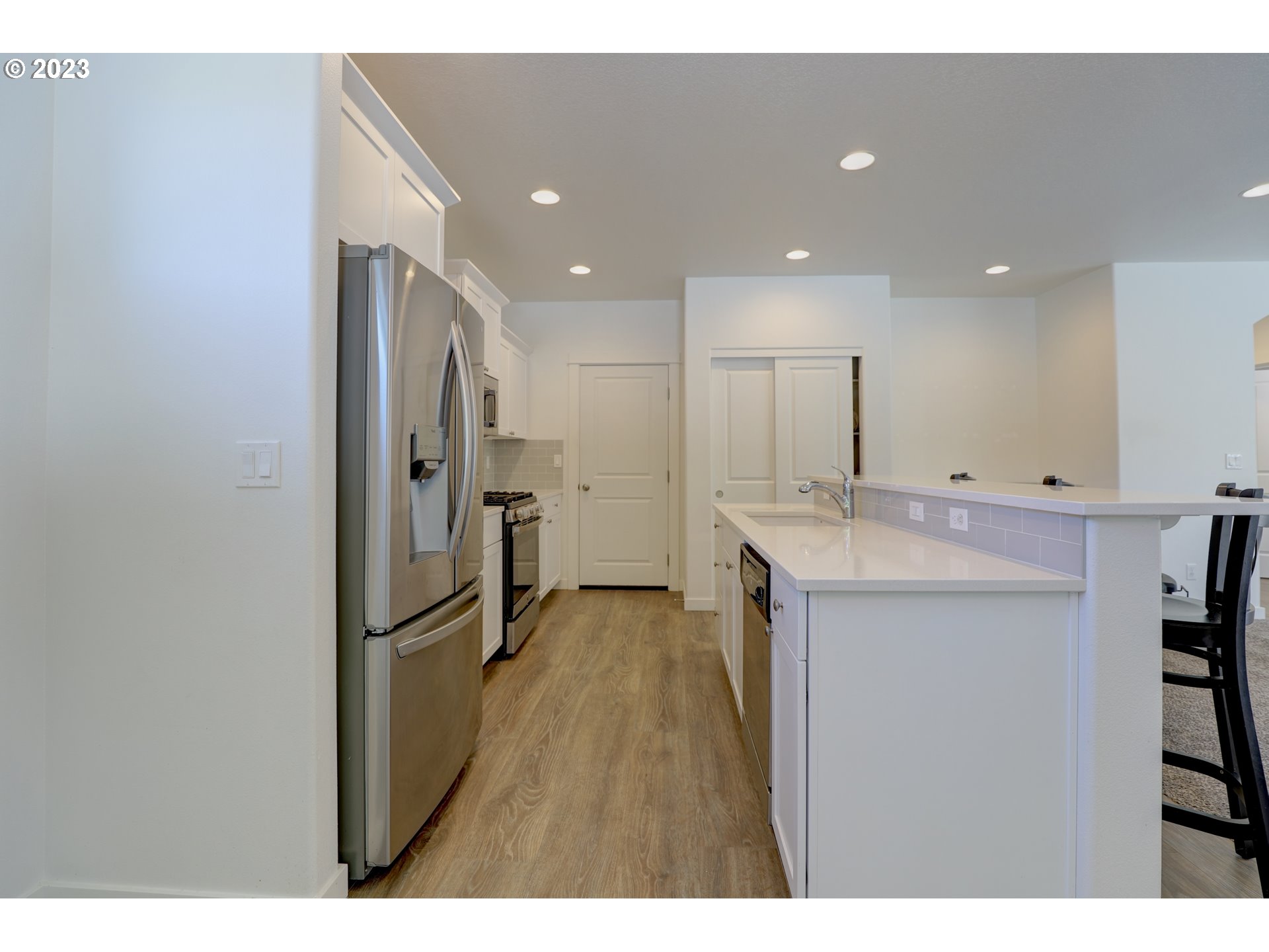 2601 Ericksen Way The Dalles, OR 97058 - Photo 13 of 37 a kitchen with kitchen island a sink appliances and a counter top space