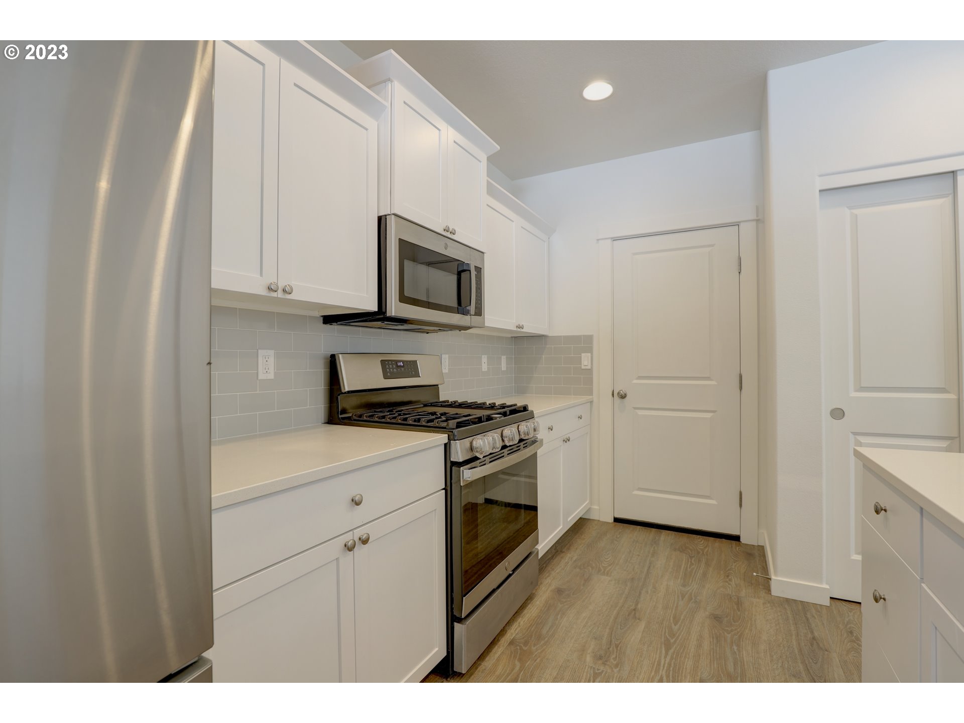 2601 Ericksen Way The Dalles, OR 97058 - Photo 14 of 37 a kitchen with appliances a sink and cabinets